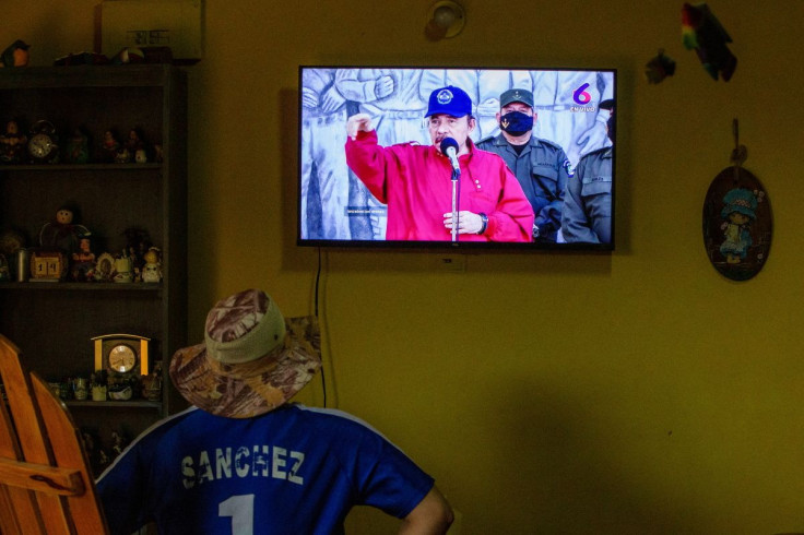 A man watches a televised speech of Nicaraguan President Daniel Ortega to mark the 88th anniversary of the death of guerrilla leader Augusto Cesar Sandino, in Managua, Nicaragua February 21, 2022.