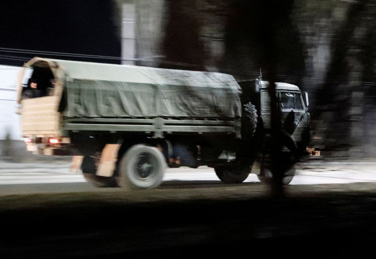 A military truck drives along a street after Russian President Vladimir Putin ordered the deployment of Russian troops to two breakaway regions in eastern Ukraine following the recognition of their independence, in the separatist-controlled city of Donets
