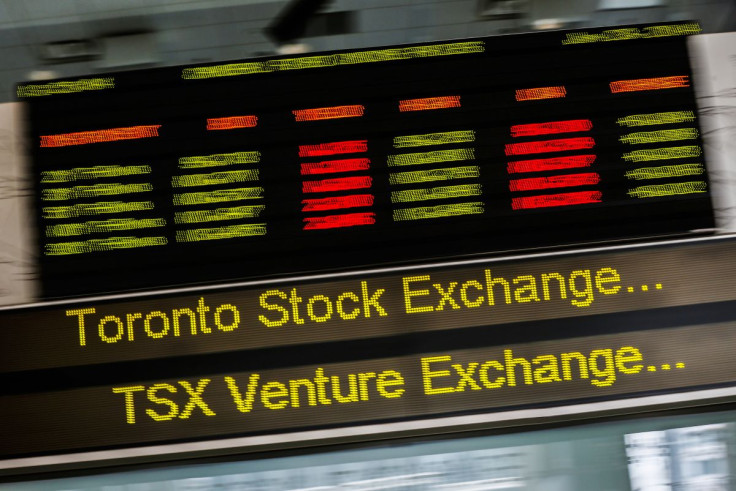 FILE PHOTO - A sign board displaying Toronto Stock Exchange (TSX) stock information is seen in Toronto June 23, 2014.