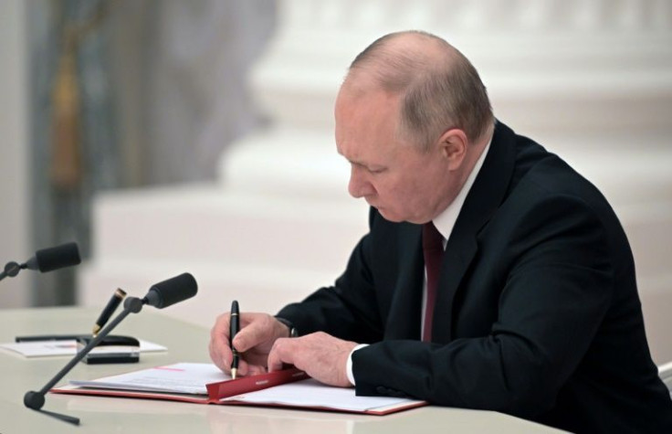 President Vladimir Putin on Monday signed a decree recognising the independence of two Russian-backed breakaway regions in eastern Ukraine
