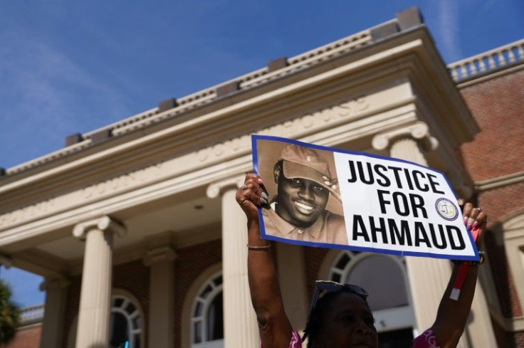 A demonstrator holds a sign outside the Glynn County Courthouse in this October 2021 file photo