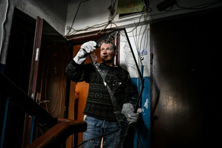 People have to constantly try and repair windows broken by the fighting, which threatens to escalate with Russia's recognition of the separatists