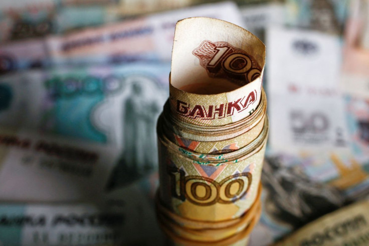A picture illustration shows rolled Russian rouble banknotes on a table in Warsaw, Poland, January 22, 2016.
