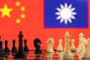Chess pieces are seen in front of displayed China and Taiwan's flags in this illustration taken January 25, 2022. 