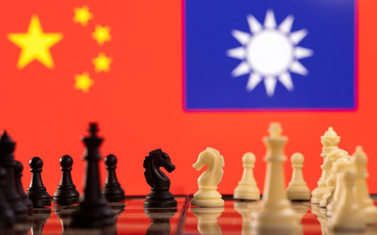 Chess pieces are seen in front of displayed China and Taiwan's flags in this illustration taken January 25, 2022. 