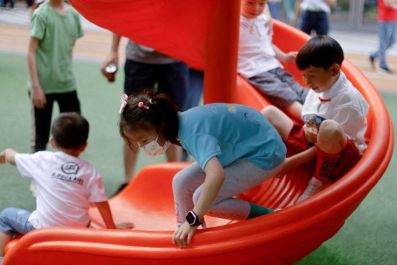 Children at a playground inside a shopping complex in Shanghai, China June 1, 2021. 
