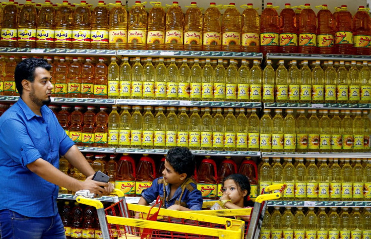 Shoppers are seen in an aisle with subsidised vegetable oils at a government outlet in Cairo, Egypt August 29, 2017.