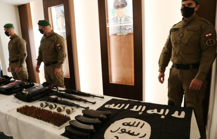 Lebanon's Internal Security Forces show off weapons and other materials they say were seized from the Islamic State group during an operation to thwart a bomb plot against Beirut's southern suburbs
