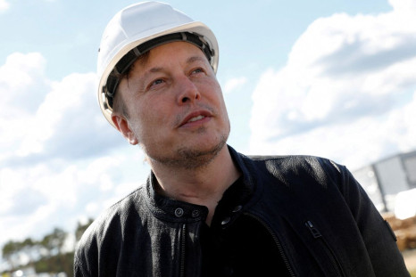 SpaceX founder and Tesla CEO Elon Musk looks on as he visits the construction site of Tesla's gigafactory in Gruenheide, near Berlin, Germany, May 17, 2021. 