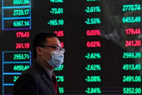 A man wearing a protective mask is seen inside the Shanghai Stock Exchange building, as the country is hit by a new coronavirus outbreak, at the Pudong financial district in Shanghai, China February 28, 2020. 