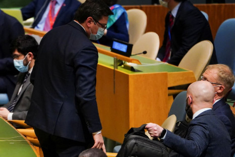 Ukraine's Foreign Minister Dmytro Kuleba and other Ukrainian representatives prepare to leave as Russian Ambassador to the UN Vasily Nebenzya takes the podium during a meeting of the U.N. General Assembly on the situation between Russia and Ukraine, at th