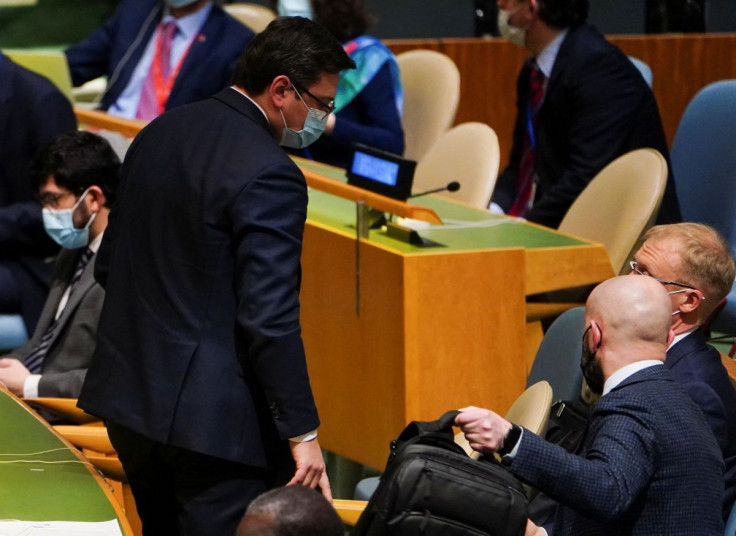 Ukraine's Foreign Minister Dmytro Kuleba and other Ukrainian representatives prepare to leave as Russian Ambassador to the UN Vasily Nebenzya takes the podium during a meeting of the U.N. General Assembly on the situation between Russia and Ukraine, at th