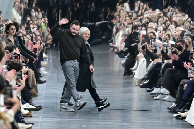 British fashion designer Kim Jones and Italian fashion designer Silvia Venturini Fendi acknowledge the appplause after the Fendi catwalk show