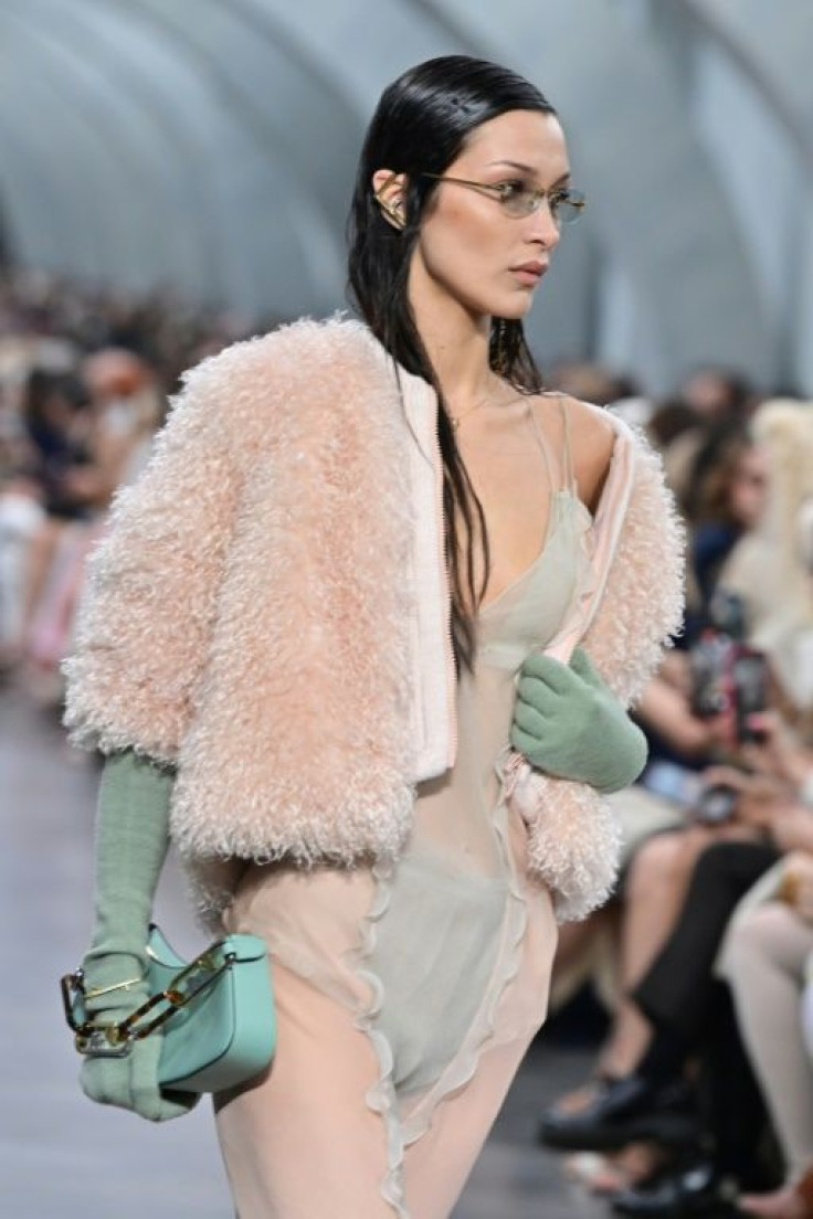 Bella Hadid pened the show in a pink mohair jacket paired with a transparent, lingerie-like dress