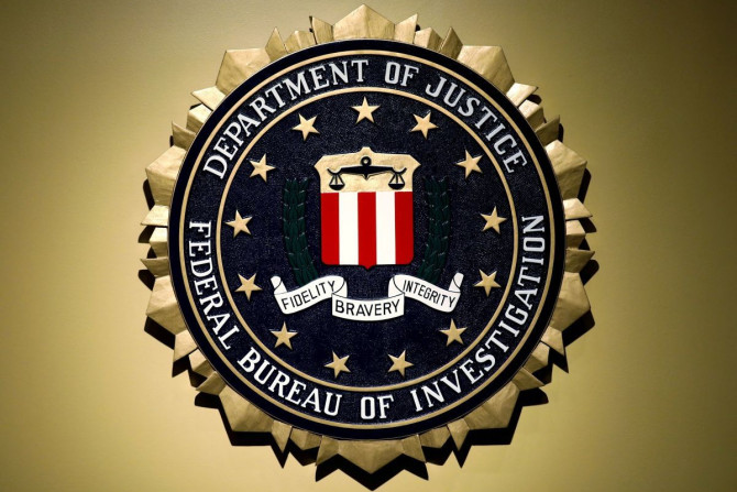 The Federal Bureau of Investigation seal is seen at FBI headquarters before a news conference by FBI Director Christopher Wray on the U.S Justice Department's inspector general's report regarding the actions of the Federal Bureau of Investigation and the 