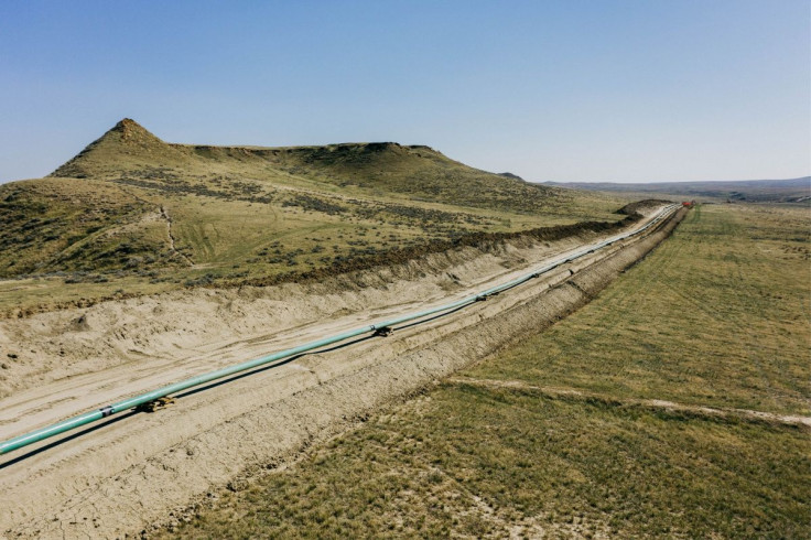 An extension of Denbury Inc's Greencore carbon pipeline is ready to be lowered into its trench, in Montana, U.S., 2021. Denbury/Handout via REUTERS