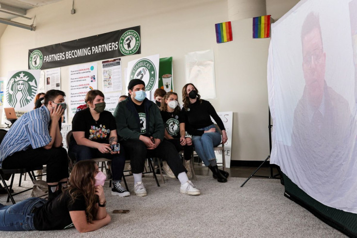 Starbucks workers watch and react to a decision by the National Labor Relations Board to postpone a scheduled union vote count in Buffalo, New York, U.S., February 23, 2022.