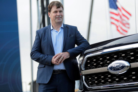 Ford Motor Co. CEO Jim Farley poses next to a new 2021 Ford F-150 pickup truck at the Rouge Complex in Dearborn, Michigan, U.S. September 17, 2020. 