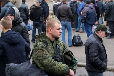 Men gather at a military mobilization point in the separatist-controlled city of Donetsk, Ukraine February 23, 2022. 