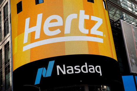 A screen displays the Hertz logo during the Hertz Corporation IPO at the Nasdaq Market site in Times Square in New York City, U.S., November 9, 2021. 