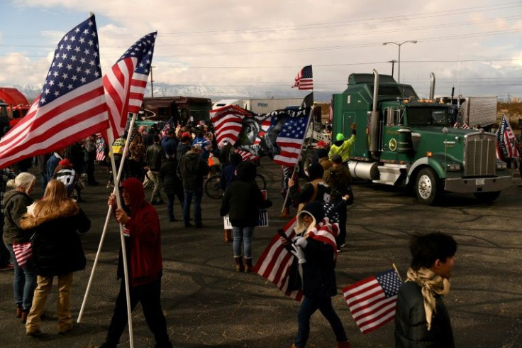 Truckers and their supporters gather in Adelanto, California ahead of a 'People's Convoy' across the United States to Washington DC