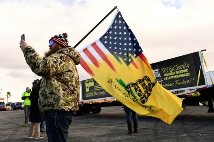Many of the flags in evidence at the rally in Adelanto are common motifs among supporters of former president Donald Trump