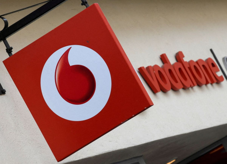 Branding hangs outside a Vodafone shop in Oxford, Britain, May 16, 2017. 