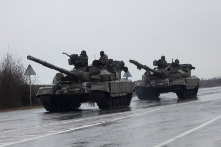 Tanks move into the city, after Russian President Vladimir Putin authorized military operation in eastern Ukraine, in Mariupol