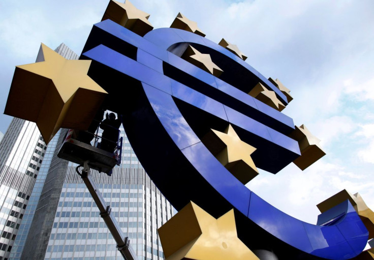 Workers maintain the huge Euro logo in front of the headquarters of the European Central Bank (ECB) in Frankfurt, December 6, 2011.