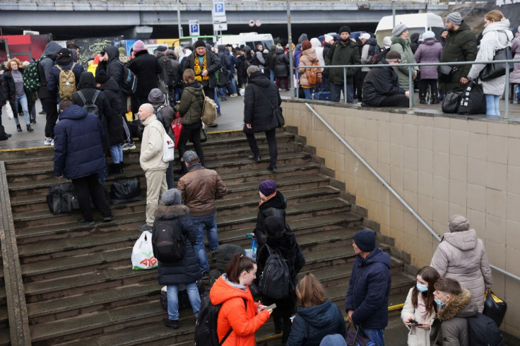 People wait at a bus station to go to western parts of the country, after Russian President Vladimir Putin authorized a military operation in eastern Ukraine, in Kyiv, Ukraine, February 24, 2022. 