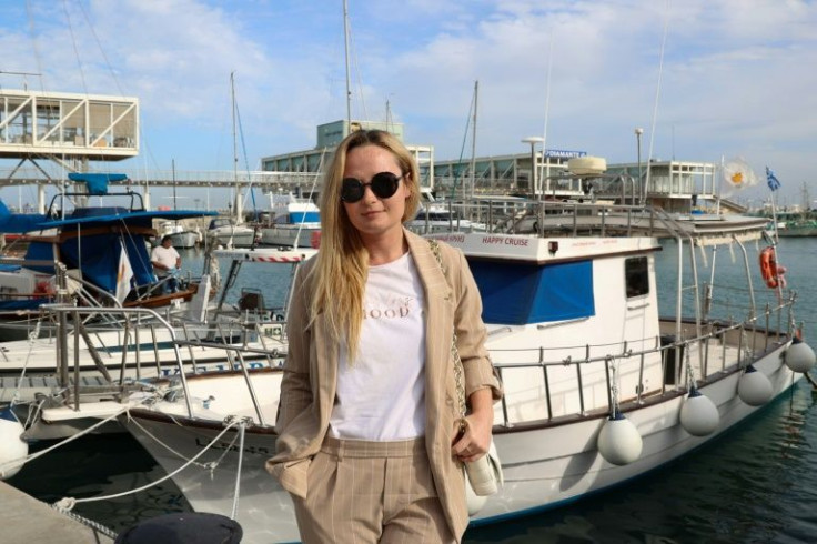 Ksenia Bordianou, a 36-year-old Ukrainian yacht stewardess whose mother's family hails from Siberia, poses for a picture in the Cypriot seaside town of Limassol
