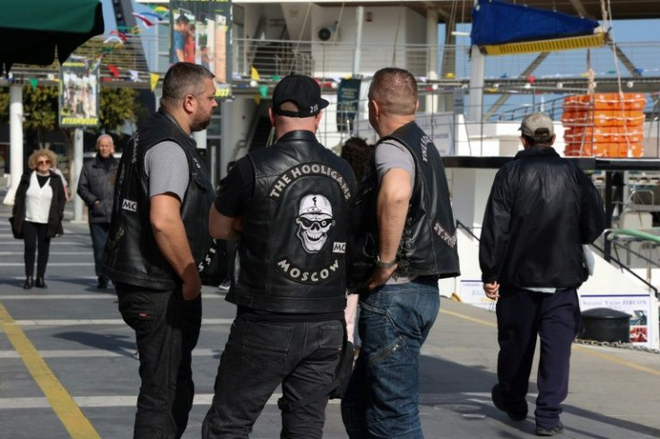 A group of Russian bikers, clad in leather waistcoats with Moscow and St Petersburg emblazoned on the back, gather in Limassol