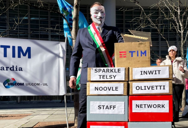 Telecom Italia workers take part in a flash mob as trade unions call for a strike against the company's plan for a single network, in Milan, Italy, February 23, 2022.