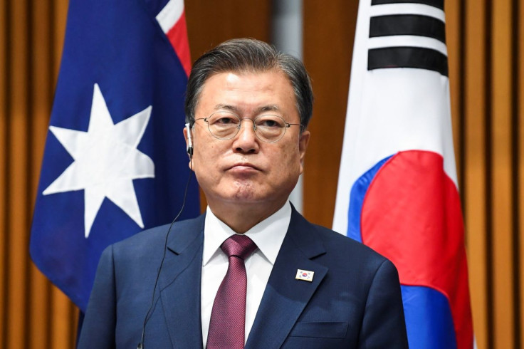 South Korean President Moon Jae-in witnesses a signing ceremony at Parliament House, in Canberra, Australia December 13, 2021. Lukas Coch/Pool via REUTERS