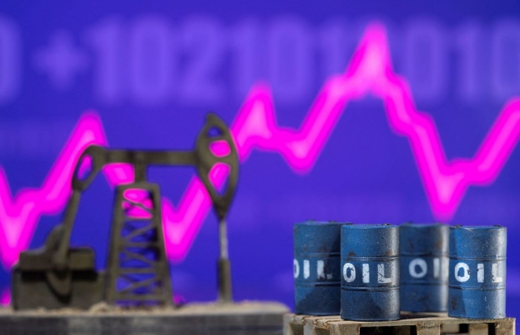 Models of oil barrels and a pump jack are displayed in front of a rising stock graph and "$100" in this illustration taken February 24, 2022.