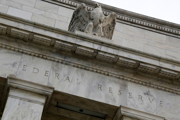 An eagle tops the U.S. Federal Reserve building's facade in Washington, July 31, 2013.  