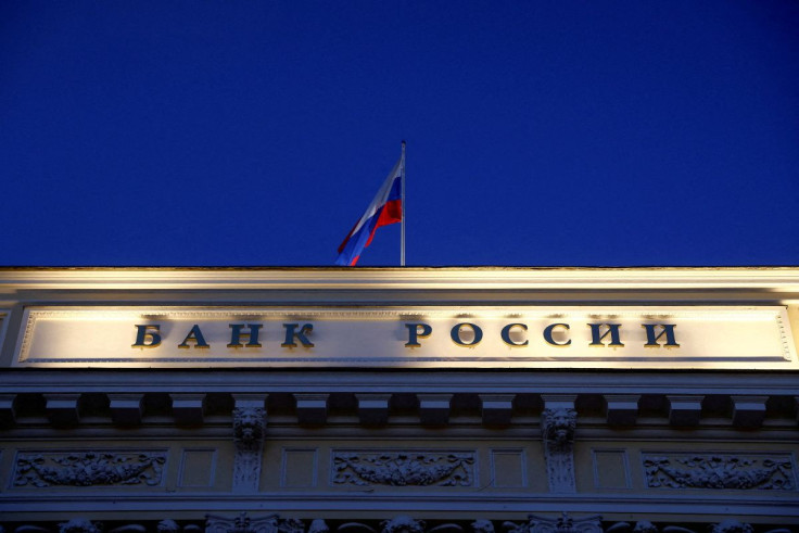 A Russian state flag flies over the Central Bank headquarters in Moscow, Russia March 29, 2021. A sign reads: "Bank of Russia". 