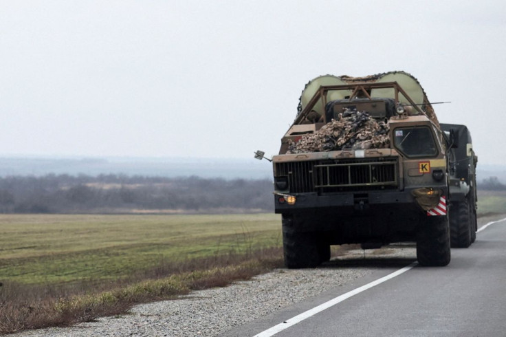A Ukrainian rocket launcher vehicle drives west of the coastal city of Mariupol, after Russian President Vladimir Putin authorized a military operation in eastern Ukraine, in Mariupol, February 24, 2022.