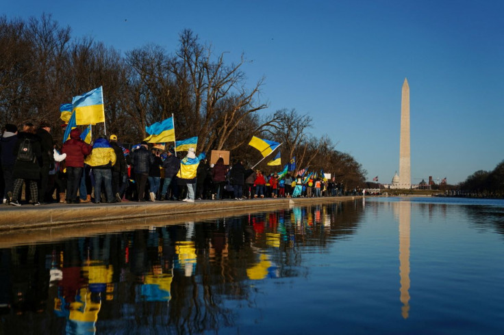 Demonstrators march along the National Mall from the Lincoln Memorial to the White House during a "Stand with Ukraine" rally in Washington, U.S., February 20, 2022.