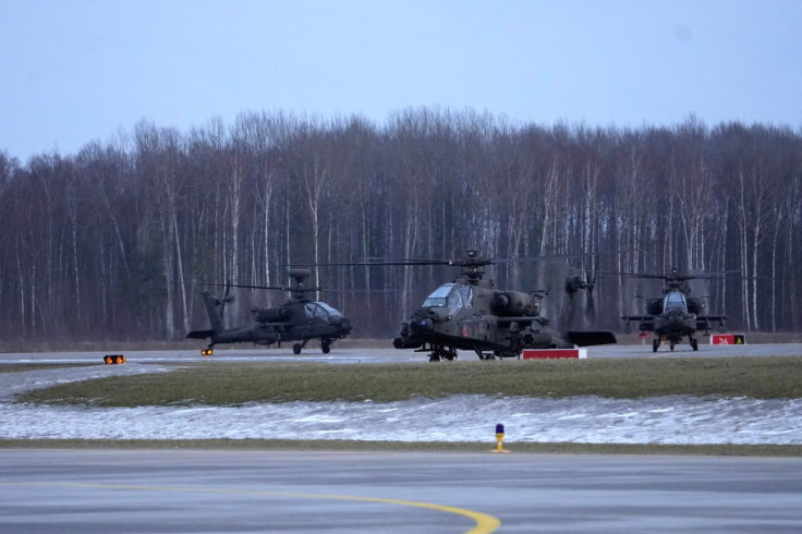 U.S. Boeing AH-64 Apache helicopters arrive to the Lielvarde military airfield, Latvia February 24, 2022.
