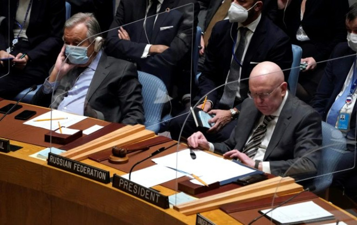 Russia's UN envoy Vassily Nebenzia (R) and UN Secretary-General Antonio Guterres (L) attend the emergency Security Council meeting on Ukraine; in a twist, Nebenzia was chairing the meeting