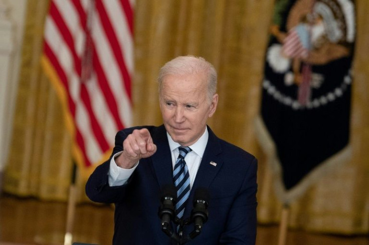 US President Joe Biden takes questions after a speech where he said President Vladimir Putin will become a 'pariah'