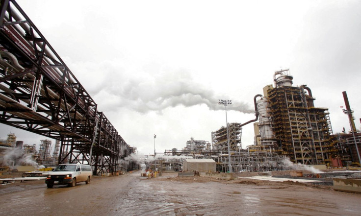 A truck drives down a street at Syncrude's oil sands operation on May 23, 2006 near Fort McMurray, Alberta.