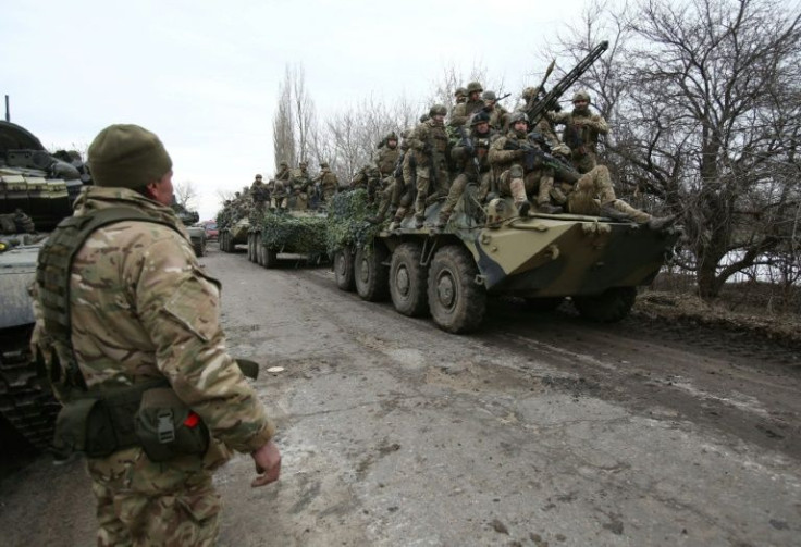 Ukrainian servicemen prepare to repel an attack in Ukraine's Lugansk region