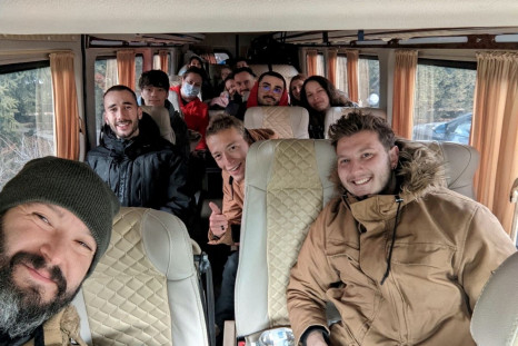 A group picture shows American evacuees on a bus as they prepare to leave Kyiv, Ukraine February 24, 2022. Project Dynamo/Handout via REUTERS