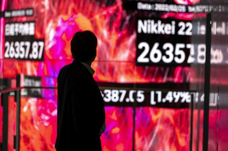 Asian markets took their lead from a rally on Wall Street after Washington decided against imposing the stiffest sanctions on Russia