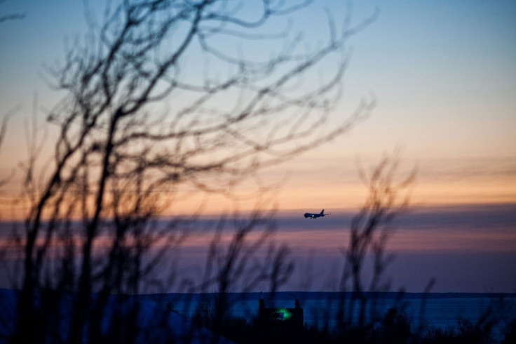 A passenger plane approaches Ted Stevens Anchorage International Airport on a cold and clear day in Achorage, Alaska, November 8, 2011.