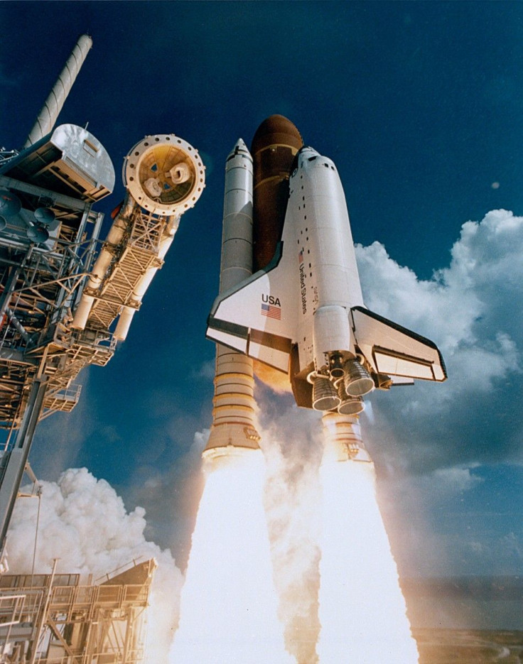 Space Shuttle Atlantis lifting off from Kennedy Space Center
