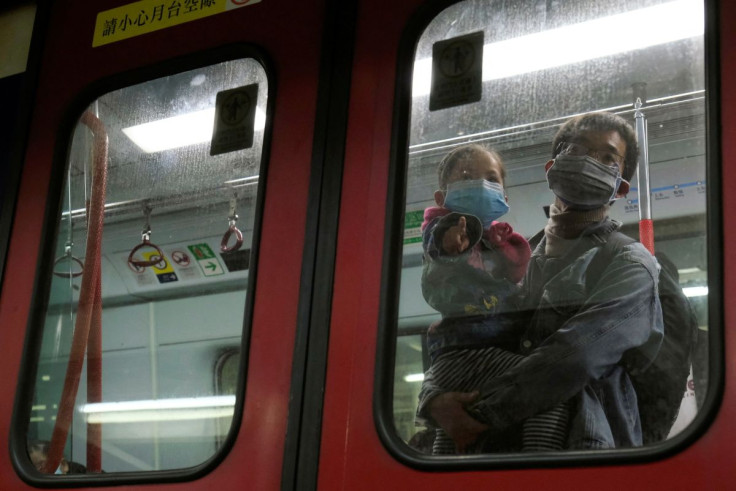 Passengers wear face masks in a Hong Kong-bound MTR train at Lo Wu MTR station, before the closing of the Lo Wu border following the coronavirus outbreak in Hong Kong, China February 3, 2020. 