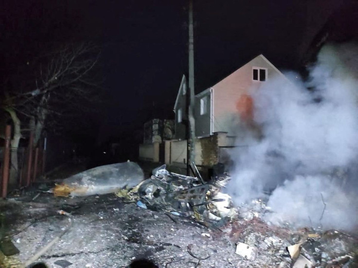 A view shows the wreckage of an unidentified aircraft in a residential area in Kyiv, Ukraine, in this handout picture released February 25, 2022. Press service of the Ukrainian State Emergency Service/Handout via REUTERS